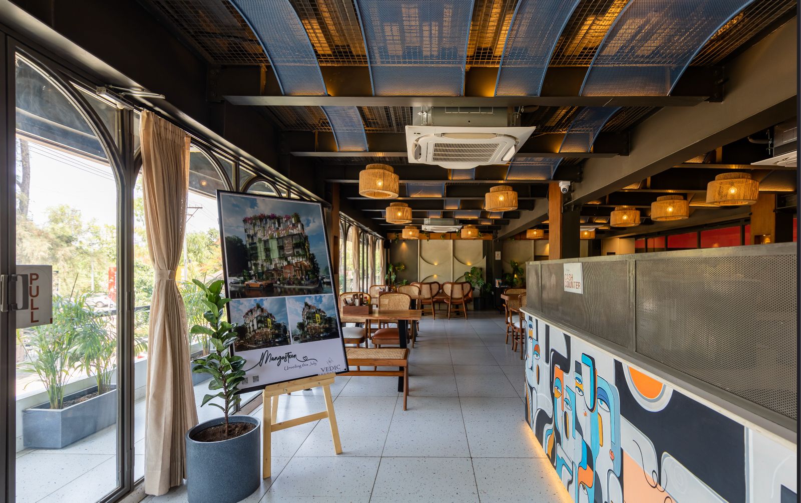 Mangosteen Cafe interior — warm lights, boho decor, inviting ambiance